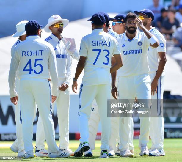 Jasprit Bumrah of India celebrates the wicket of David Bedingham of South Africa with team mates during day 2 of the 2nd Test match between South...