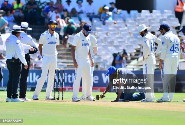 Grounds staff repair the wicket during day 2 of the 2nd Test match between South Africa and India at Newlands Cricket Ground on January 4, 2024 in...