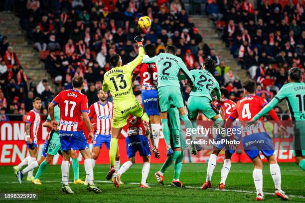 Gazzaniga of Girona FC fight for the ball against Atletico de Madrid players during the La Liga Match match between Girona FC v Atletico de Madrid at...