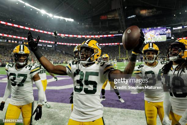 Corey Ballentine of the Green Bay Packers celebrates with teammates after an interception during the first quarter against the Minnesota Vikings at...