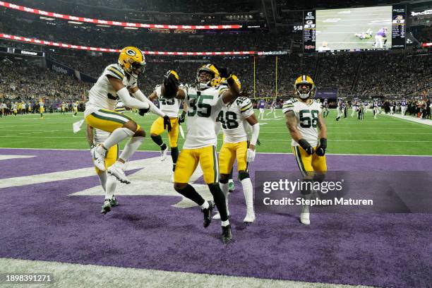 Corey Ballentine of the Green Bay Packers celebrates with teammates after an interception during the first quarter against the Minnesota Vikings at...