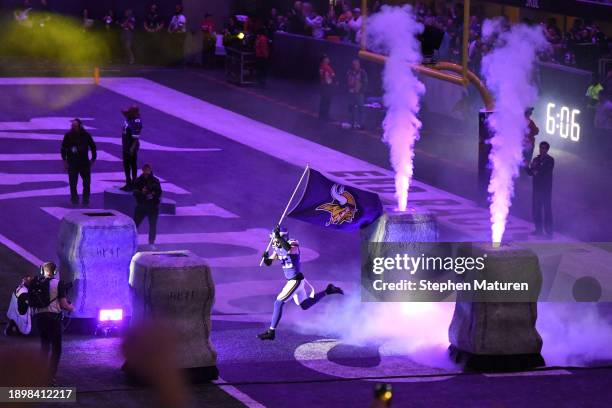 Harrison Smith of the Minnesota Vikings runs onto the field prior to a game against the Green Bay Packers at U.S. Bank Stadium on December 31, 2023...