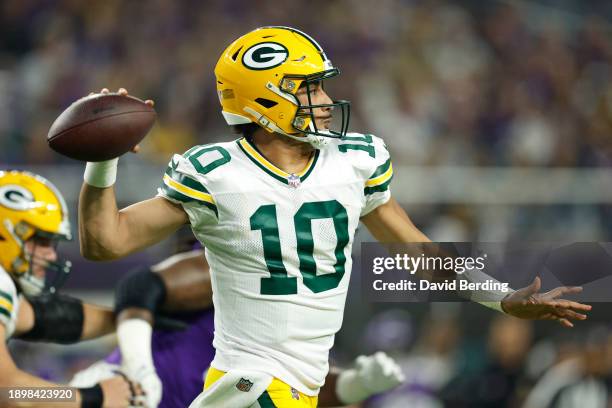 Jordan Love of the Green Bay Packers looks to pass during the first quarter against the Minnesota Vikings at U.S. Bank Stadium on December 31, 2023...