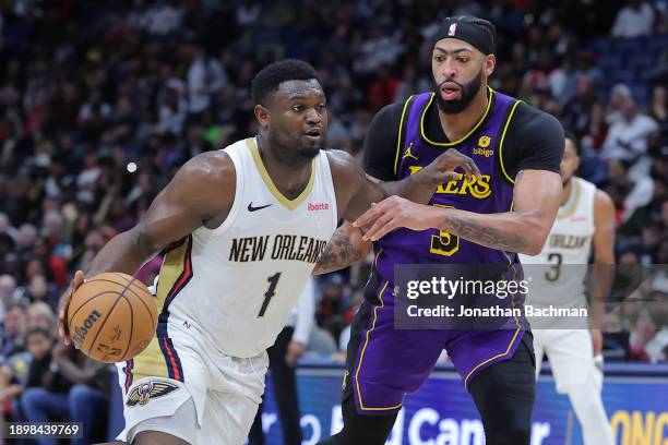 Zion Williamson of the New Orleans Pelicans drives against Anthony Davis of the Los Angeles Lakers during the second half at the Smoothie King Center...