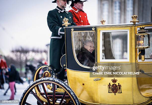 Queen Margrethe II of Denmark is escorted by the Gardehusar Regiment's Horseskort in the gold carriage from Christian IX's Palace, Amalienborg, to...
