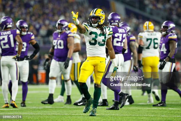 Aaron Jones of the Green Bay Packers reacts after a first down during the second quarter against the Minnesota Vikings at U.S. Bank Stadium on...