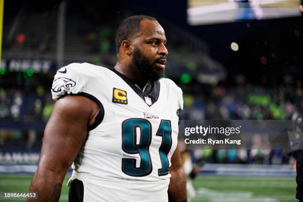 Fletcher Cox of the Philadelphia Eagles looks on during pregame warmups before an NFL football game against the Seattle Seahawks at Lumen Field on...