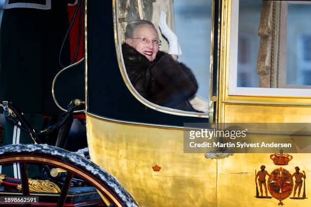 Queen Margrethe II of Denmark sits in the Golden Carriage escorted by the Guard Hussar Regiment's Mounted Squadron from Amalienborg to Christiansborg...