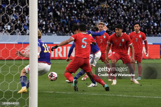 Ao Tanaka of Japan scores the team's first goal during the international friendly match between Japan and Thailand at National Stadium on January 1,...