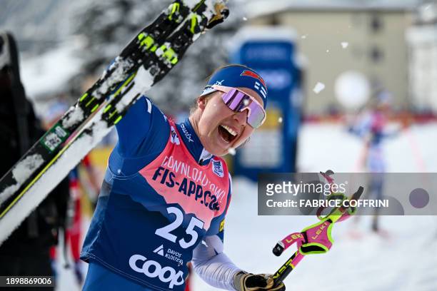 Finland's Kerttu Niskanen reacts after winning the cross-country skiing Women's Pursuit Classic event at the FIS Tour de Ski stage, in Davos, on...
