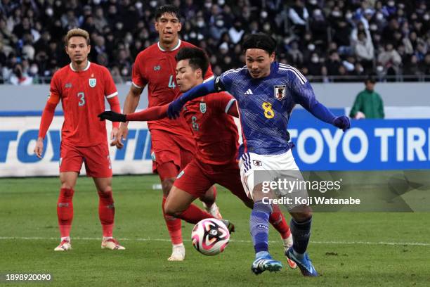 Takumi Minamino of Japan scores the team's fifth goal during the international friendly match between Japan and Thailand at National Stadium on...