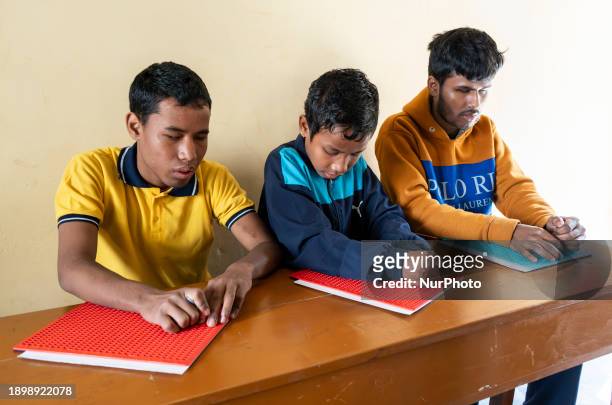 Visually impaired students are writing using the Braille system at Guwahati Blind High School in Guwahati, Assam, India, on January 4, 2024. World...