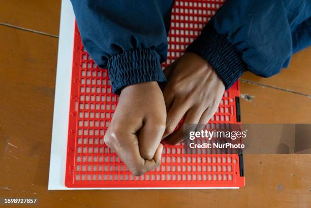 Visually impaired students are writing using the Braille system at Guwahati Blind High School in Guwahati, Assam, India, on January 4, 2024. World...