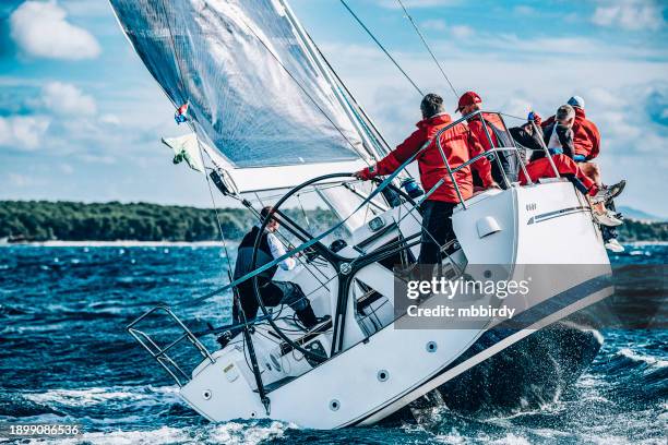 sailing crew on sailboat on regatta - sports team event stock pictures, royalty-free photos & images