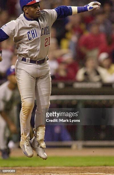 Sammy Sosa of the Chicago Cubs watches his 500th career home run go over the wall against the Cincinnati Reds during the seventh inning at Great...
