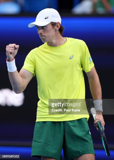 Alex de Minaur of Team Australia celebrates winning a game in his singles match against Taylor Fritz of Team USA during day four of the 2024 United...