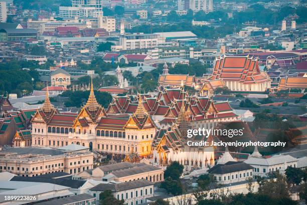 an aerial picture of bangkok's grand palace lighted at night. - grand palace bangkok stock pictures, royalty-free photos & images