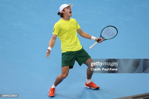 Alex de Minaur of Team Australia celebrates winning a game during the second set in his singles match against Taylor Fritz of Team USA during day...