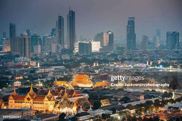an aerial picture of bangkok's grand palace lighted at night. - grand palace bangkok stock pictures, royalty-free photos & images