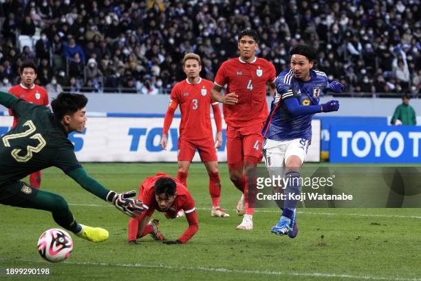 Takumi Minamino of Japan scores the team's fifth goal during the international friendly match between Japan and Thailand at National Stadium on...
