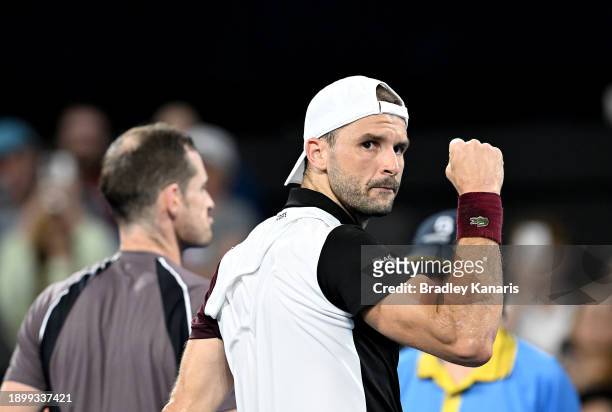 Grigor Dimitrov of Bulgaria celebrates victory after winning the match against Andy Murray of Great Britain during day two of the 2024 Brisbane...
