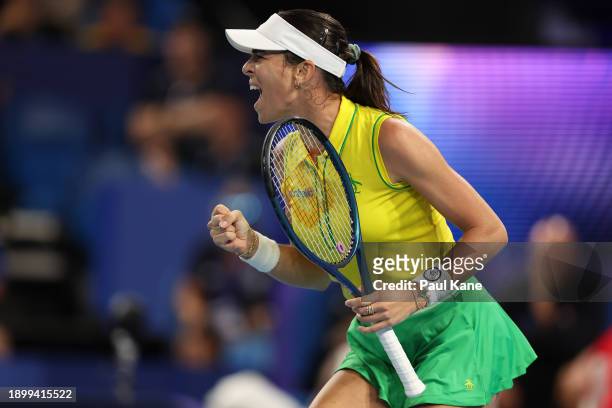 Ajla Tomljanovic of Team Australia celebrates winning a game in her singles match against Jessica Pegula of Team USA during day four of the 2024...