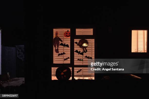 halloween decorations in a cozy home window - cozy stock pictures, royalty-free photos & images