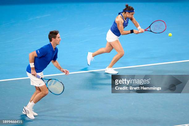 Caroline Garcia of France and Edouard Roger-Vasselin of France compete in the Group D doubles match against Alexander Zverev of Germany and Angelique...