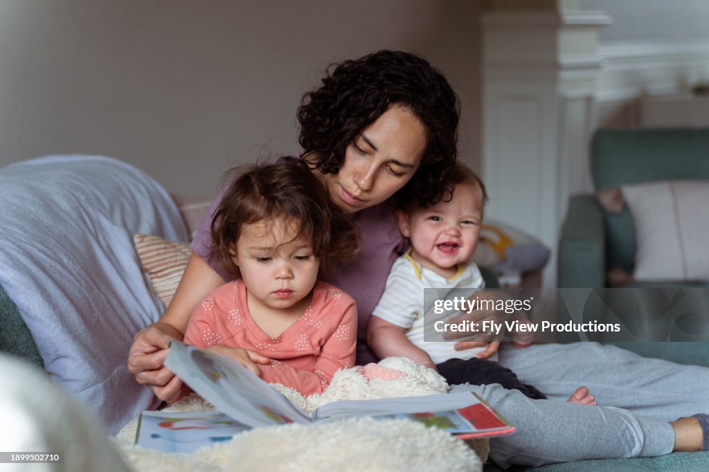 Mom enjoying relaxing morning at home with sleepy and happy kids