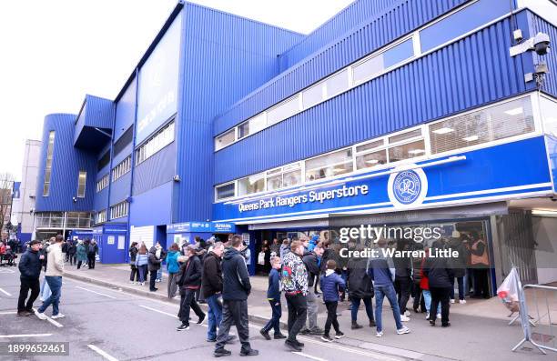 Fans arrive ahead of the Sky Bet Championship match between Queens Park Rangers and Cardiff City at Loftus Road on January 01, 2024 in London,...