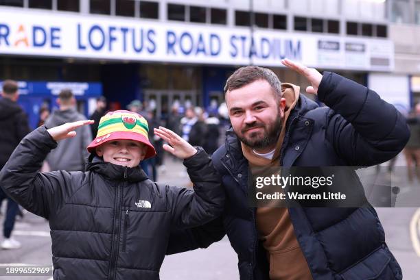 Fans arrive ahead of the Sky Bet Championship match between Queens Park Rangers and Cardiff City at Loftus Road on January 01, 2024 in London,...