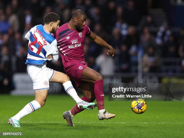 Yalou Meite of Cardiff City is tackled by Ziyad Larkeche of Queens Park Rangers during the Sky Bet Championship match between Queens Park Rangers and...