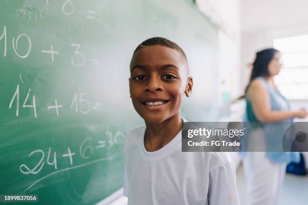 portrait of a student boy on classroom at school - black kids math stock pictures, royalty-free photos & images