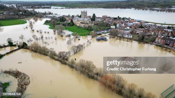 In this aerial view Tewkesbury Abbey, at the confluence of the Rivers Severn and Avon, is surrounded by flood waters after recent storms and...