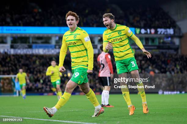 Josh Sargent of Norwich City celebrates with team mate Jack Stacey after scoring their sides first goal during the Sky Bet Championship match between...