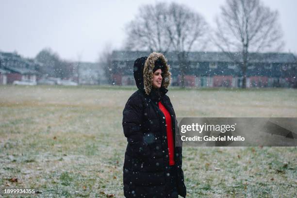 woman in the park on a snowy day - london - ontario stock pictures, royalty-free photos & images