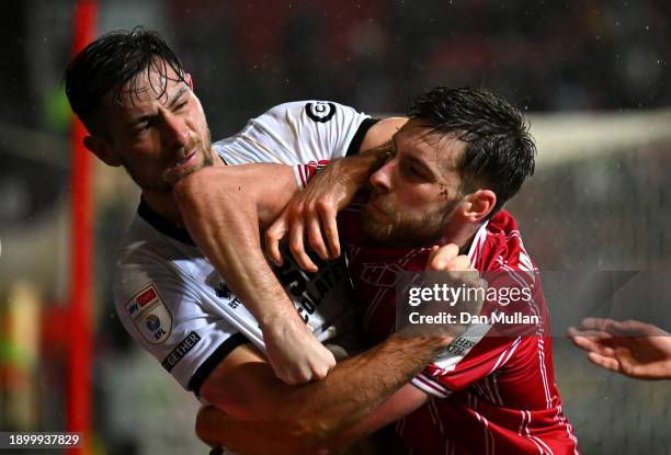 Joe Williams of Bristol City and Ryan Leonard of Millwall clash during the Sky Bet Championship match between Bristol City and Millwall at Ashton...