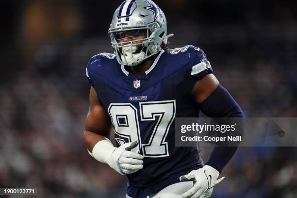 Osa Odighizuwa of the Dallas Cowboys runs across the field during an NFL football game against the Detroit Lions at AT&T Stadium on December 30, 2023...