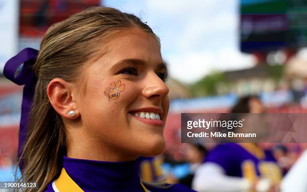 An LSU Tigers cheerleader looks on during the ReliaQuest Bowl against the Wisconsin Badgers at Raymond James Stadium on January 01, 2024 in Tampa,...