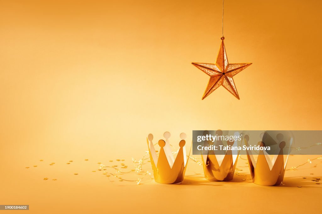 Three kings or wise men and Epiphany concept with three golden crowns