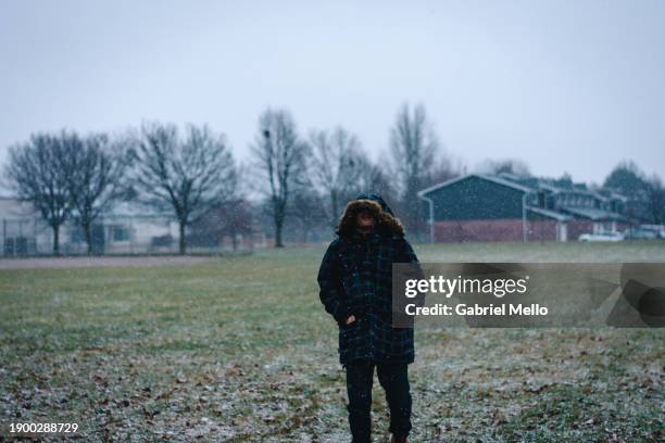 man in the park on a snowy day - london - ontario stock pictures, royalty-free photos & images