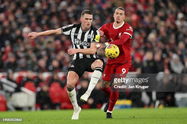 Sven Botman of Newcastle United battles for possession with Darwin Nunez of Liverpool during the Premier League match between Liverpool FC and...