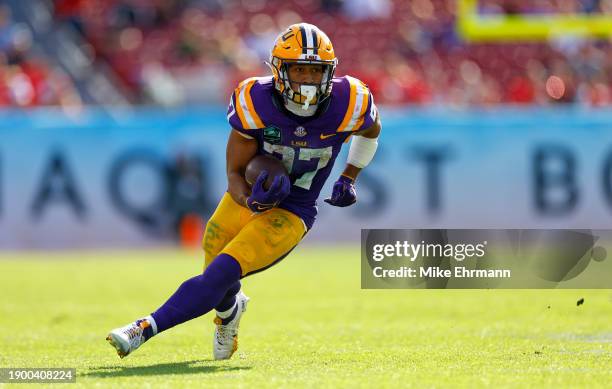 Josh Williams of the LSU Tigers rushes during the ReliaQuest Bowl against the Wisconsin Badgers at Raymond James Stadium on January 01, 2024 in...