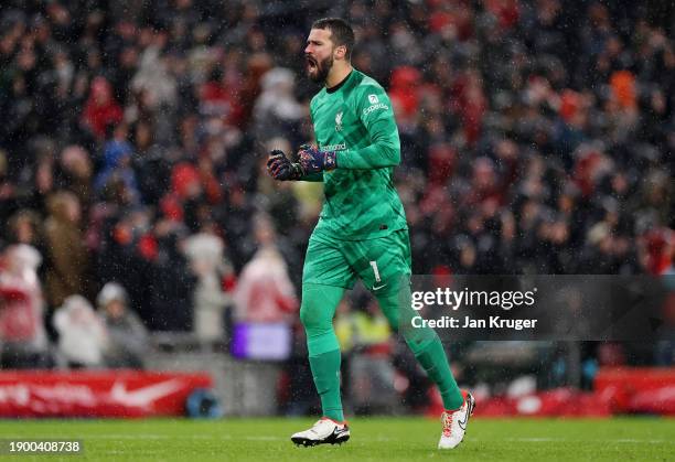 Alisson Becker of Liverpool celebrates after Mohamed Salah of Liverpool scores their sides first goal during the Premier League match between...