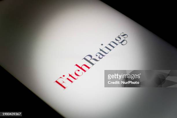 The Fitch Ratings logo is displayed on a smartphone screen in Athens, Greece, on January 4, 2024.