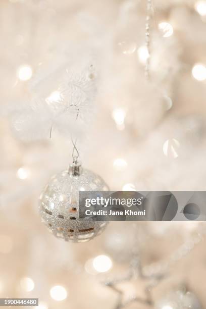white christmas tree with white ornaments - jane withes stock pictures, royalty-free photos & images