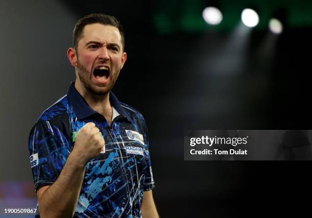 Luke Humphries of England celebrates winning his quarter final match against Dave Chisnall of England on day 14 of the 2023/24 Paddy Power World...