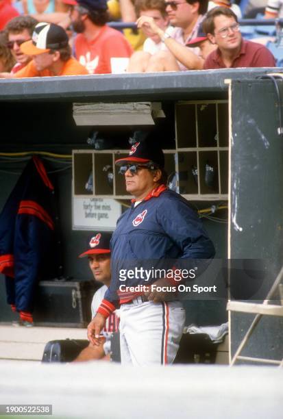 Manager Pat Corrales of the Cleveland Indians looks on from the dugout against the Baltimore Orioles during a Major League Baseball game circa 1986...