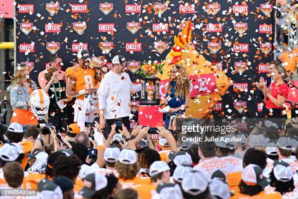 The Tennessee Volunteers accept the trophy after defeating the Iowa Hawkeyes 35-0 to win the 2024 Cheez-It Citrus Bowl at Camping World Stadium on...