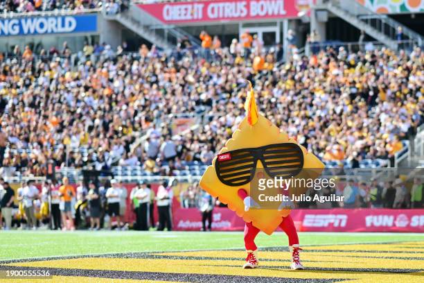 Ched-Z the Cheez-It Citrus Bowl mascot looks on during the 2024 Cheez-It Citrus Bowl between the Iowa Hawkeyes and the Tennessee Volunteers at...